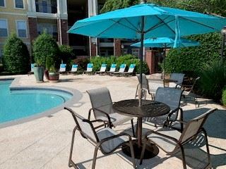 Resort-style pool with sundeck and lounge seating